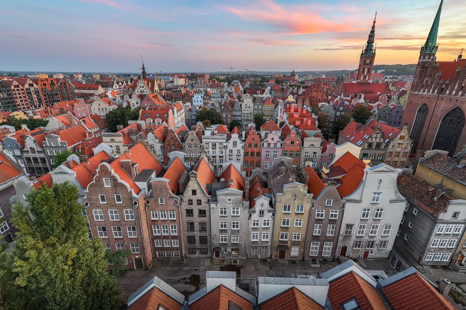 Aerial view of the historic Old Town of Gdańsk with colorful townhouses and St. Mary's Chu