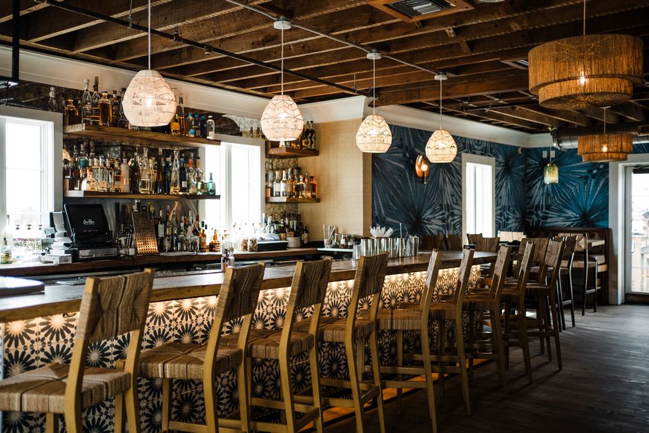 A stylish and inviting bar interior with wooden decor and trendy lighting in St. Augustine, Florida.