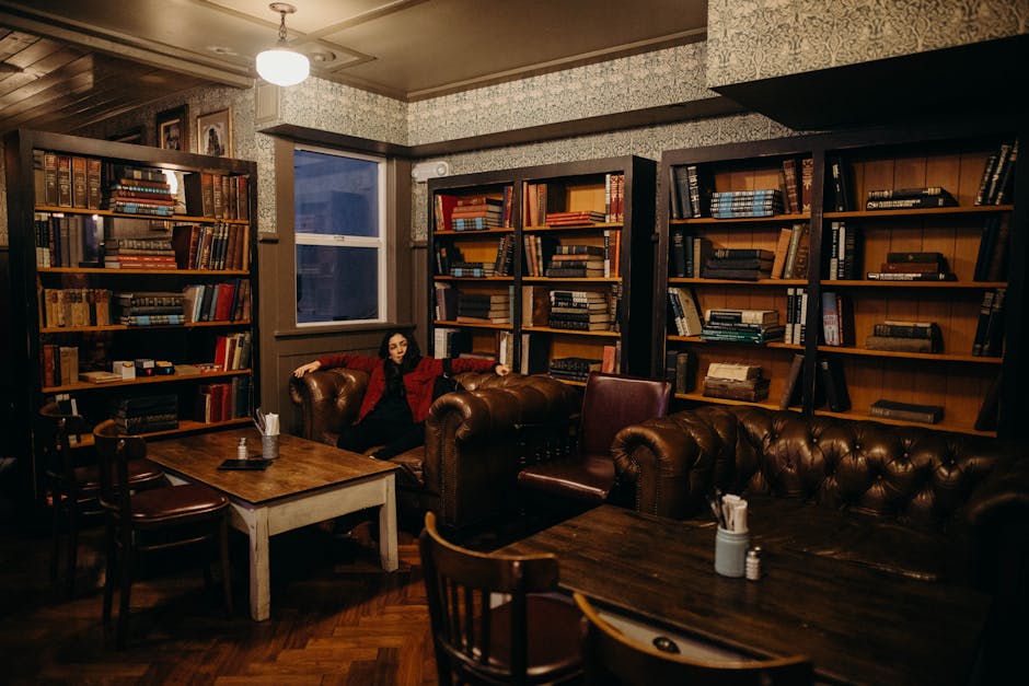 Elegant library interior with leather sofas and bookshelves, perfect for quiet reading in San Diego.