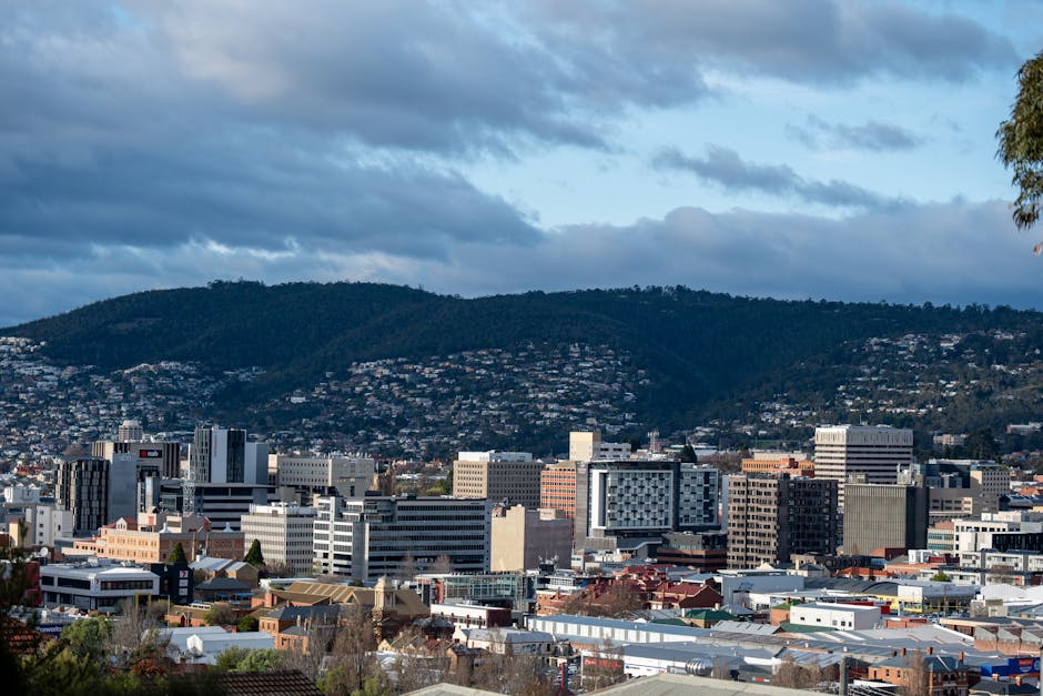 A beautiful cityscape of Hobart, Tasmania showcasing urban architecture against Mount Wellington.