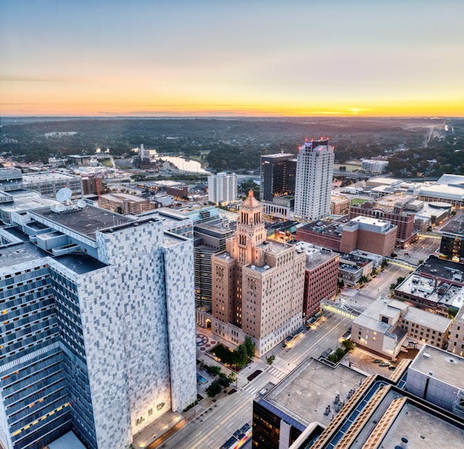Breathtaking aerial view of Rochester's cityscape during sunset, highlighting urban architecture.