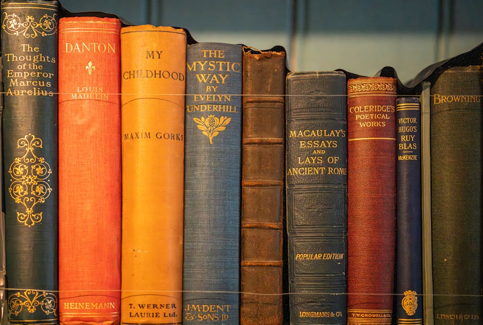 A collection of vintage books displayed on a shelf, showcasing classic literature.