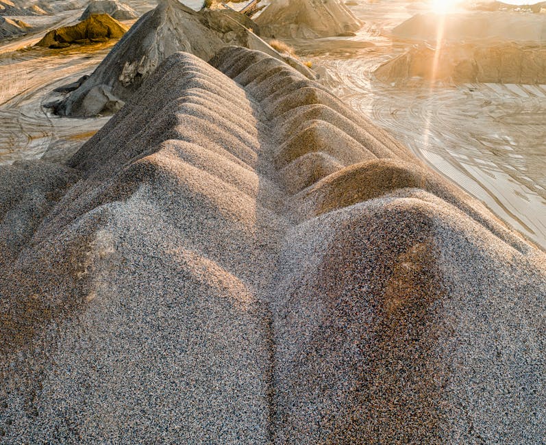 Drone shot of sunlit gravel formations in Rochester, MN quarry, showcasing natural textures.
