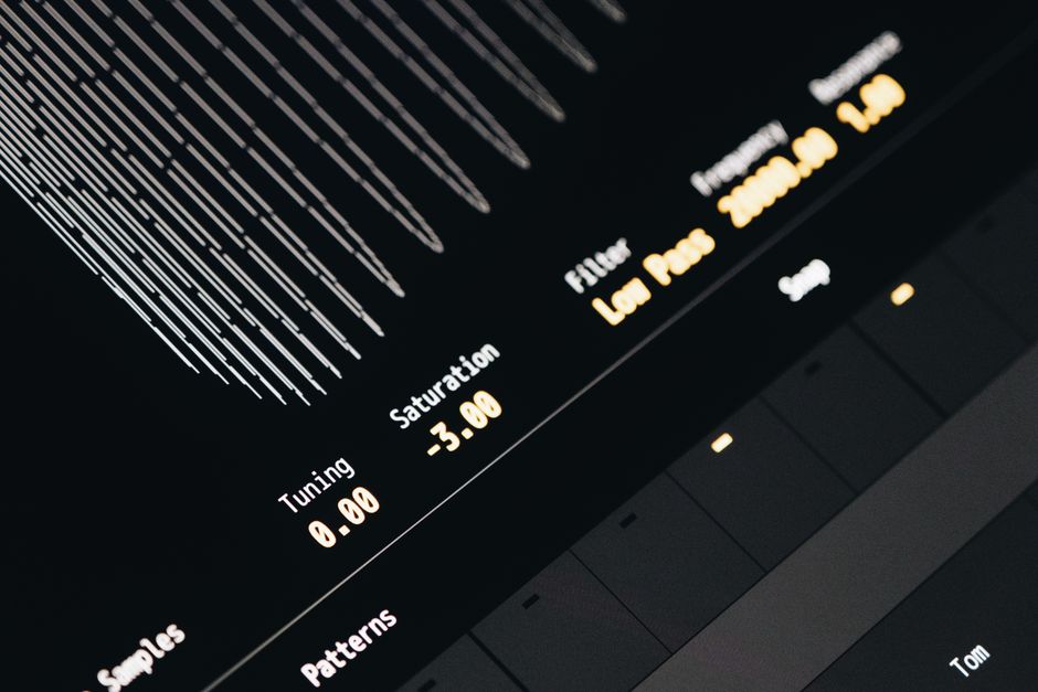 Close-up of a modern digital sound interface screen displaying tuning, saturation, and filter settings.