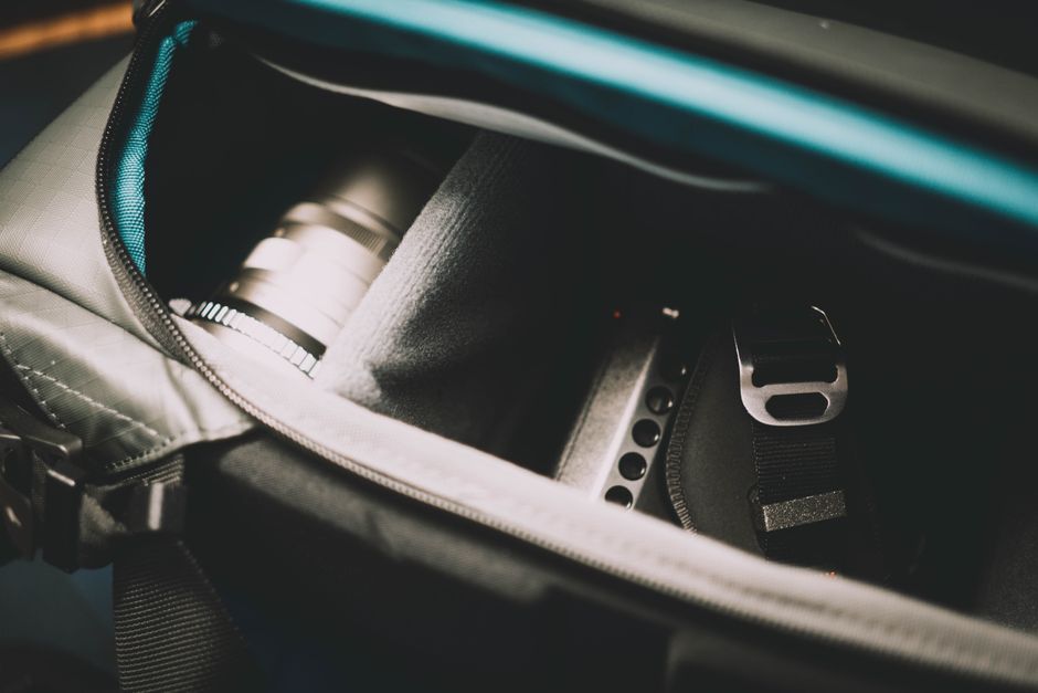 Close-up view of camera equipment stored securely in a padded bag, showcasing travel readiness.