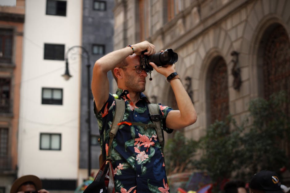A tourist photographer with a DSLR capturing the vibrant street life in Mexico City.