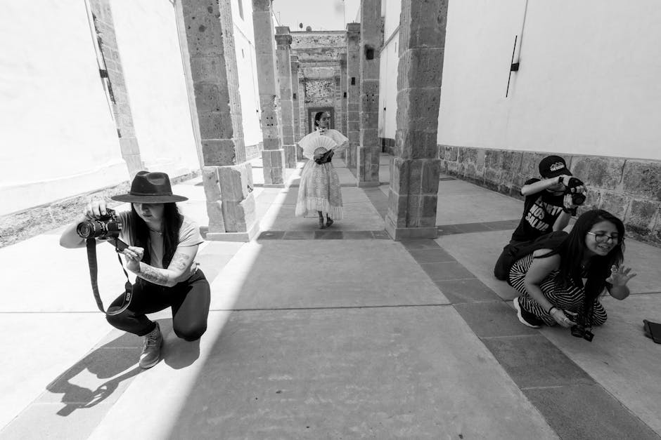 Elegant fashion photoshoot with model in traditional dress in Mexico City's historic colonnade.