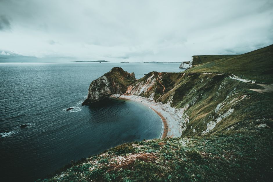 Breathtaking aerial view of the coastal cliffs and sea at Durdle Door, England.