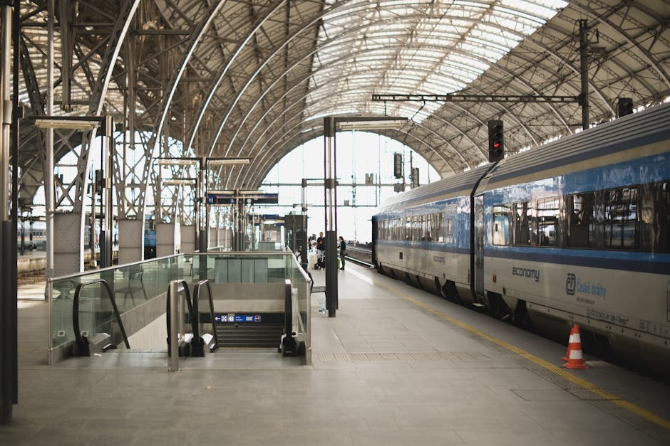 A modern train at the bustling Prague Main Railway Station, showcasing travel in Europe.
